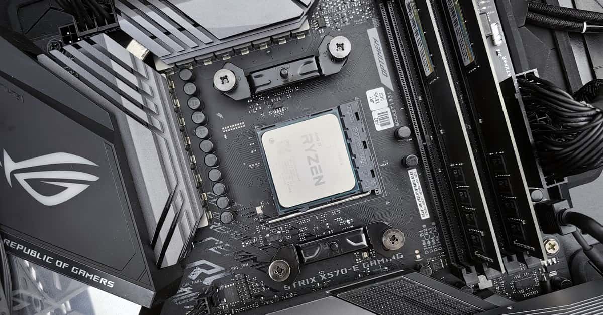 Detailed view of a gaming motherboard, showcasing an AMD processor and components.