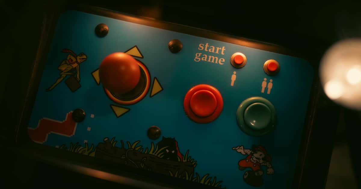 Close-up of retro arcade game controls with joystick and buttons