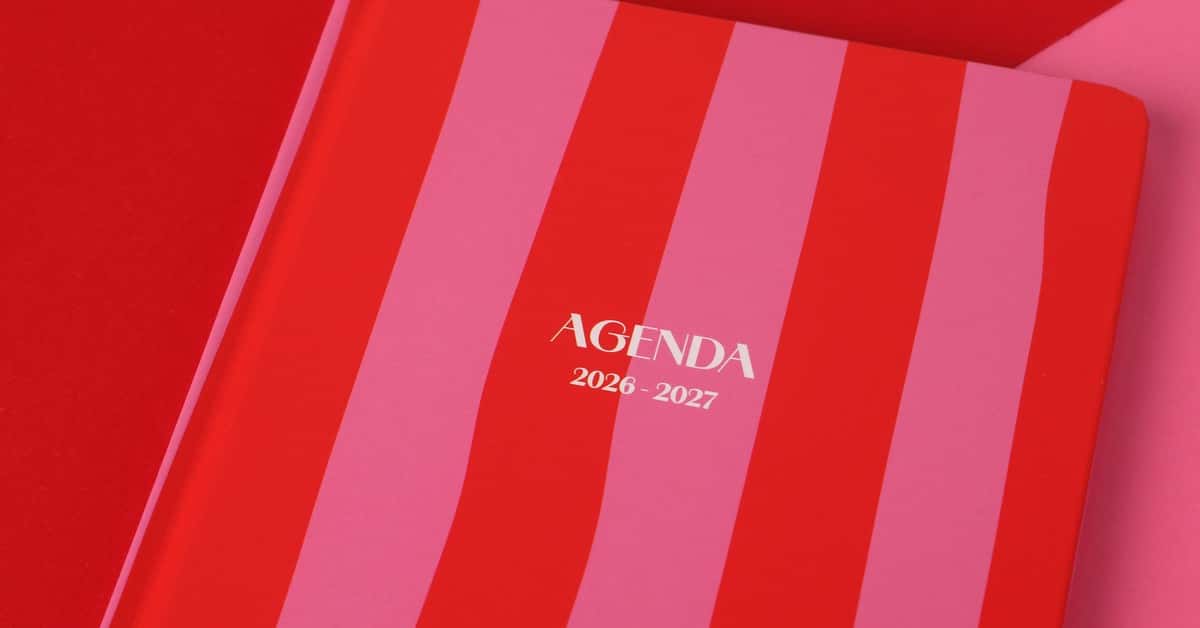 Red and pink striped agenda book for 2026-2027, perfect for planning.