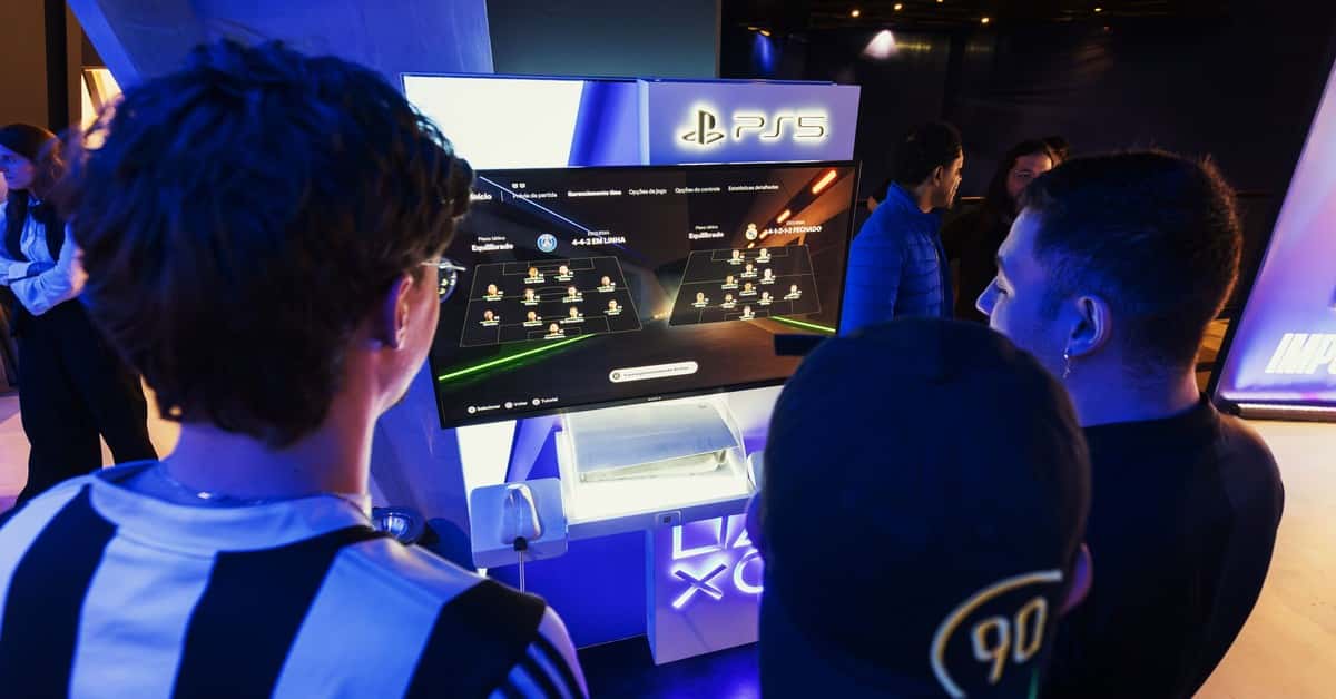 Group of gamers engaged in a PS5 event, choosing teams on a football game selection screen.