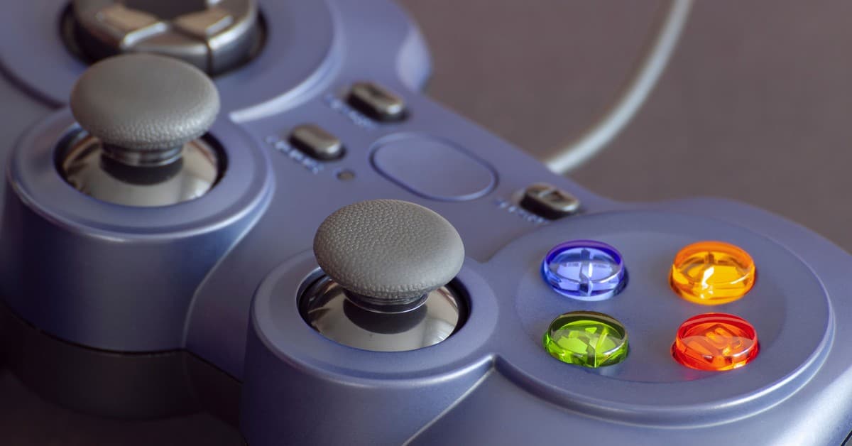 Detailed close-up of a gaming controller emphasizing its vibrant buttons.