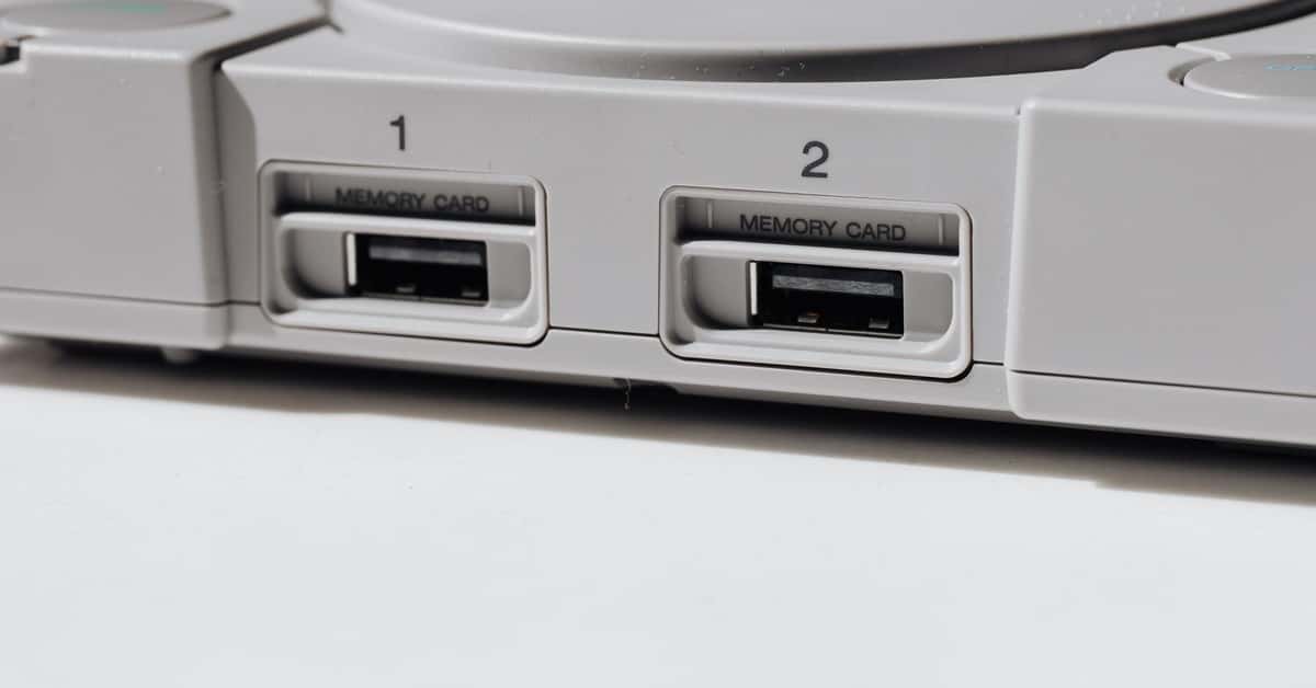 Detailed view of vintage PlayStation console featuring memory slots, capturing nostalgia.