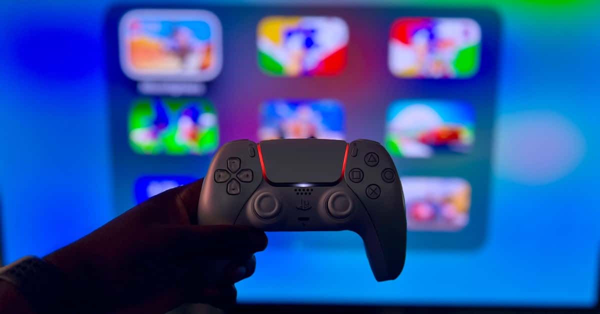 Close-up of a gaming controller against a vibrant screen in London, England.