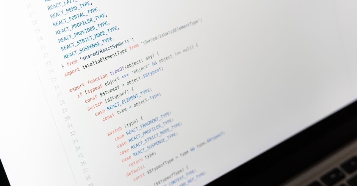 Close-up of JavaScript code on a laptop screen, showcasing programming in progress.