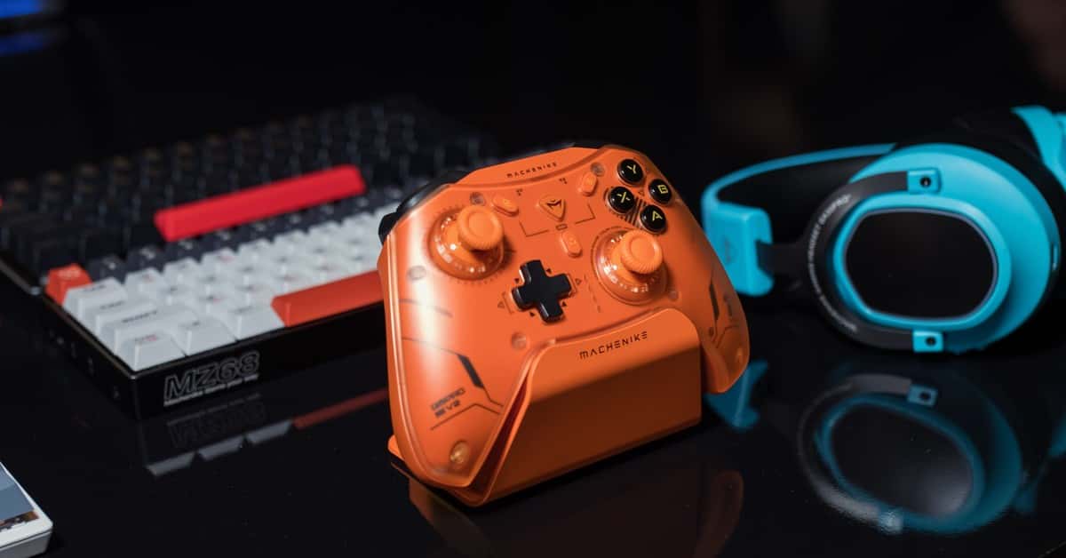 Dynamic gaming setup featuring an orange controller, keyboard, and blue headset.