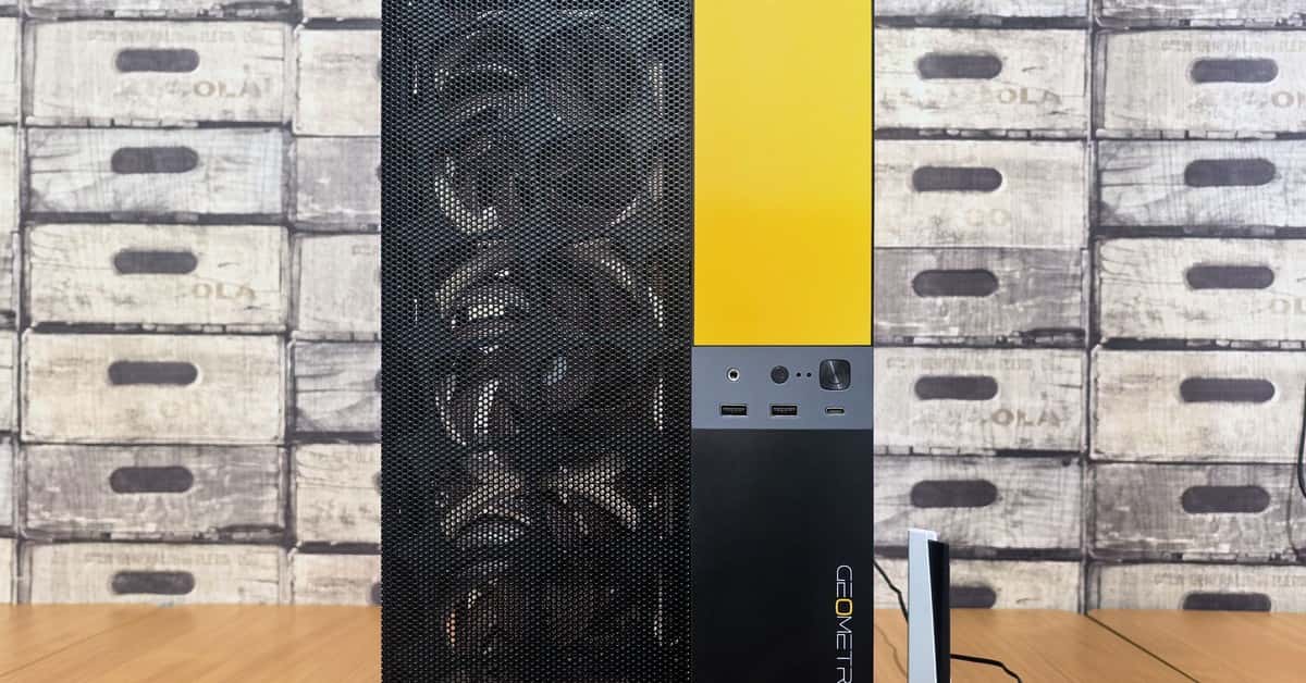 Front view of a sleek modern PC tower with yellow accents and geometric design.
