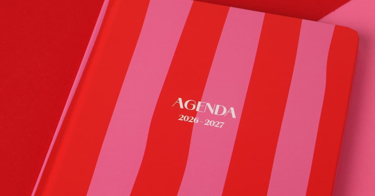 Red and pink striped agenda book for 2026-2027, perfect for planning.