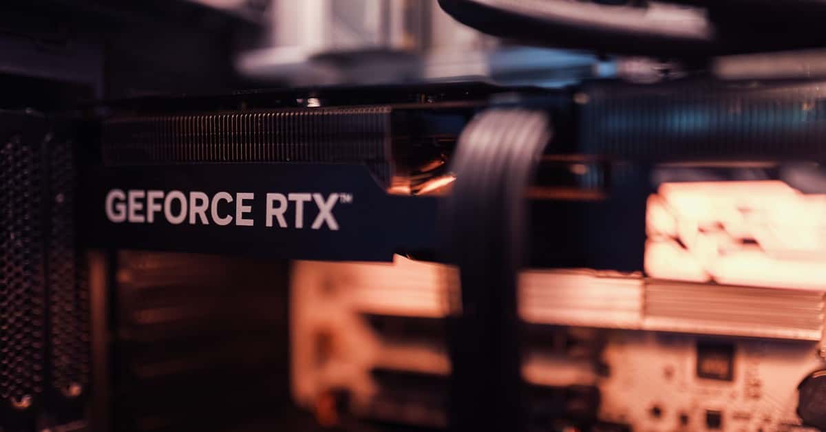 Detailed view of a GeForce RTX graphics card installed in a computer setup, highlighting modern technology.