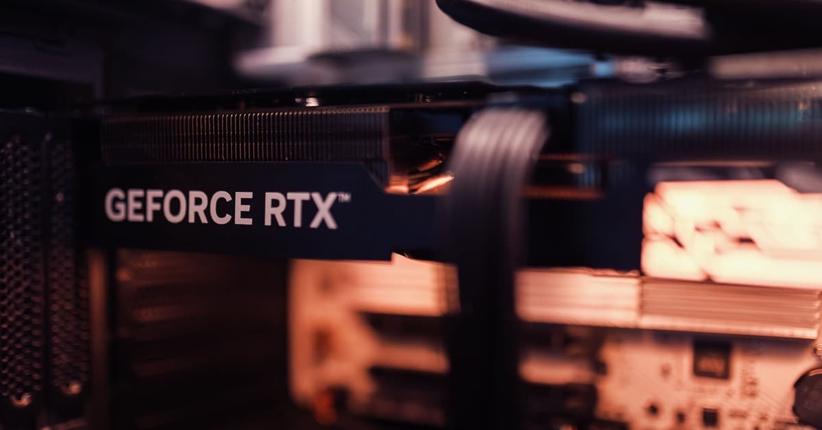 Detailed view of a GeForce RTX graphics card installed in a computer setup, highlighting modern technology.
